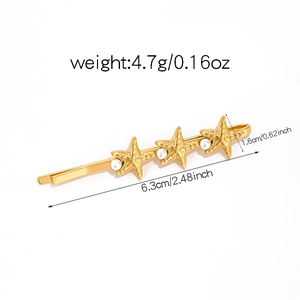 Detailed view of gold starfish hair clip with pearls including 6.3cm size dimensions