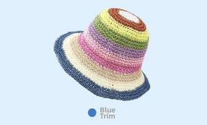 Detailed close-up of rainbow striped knit bucket hat showing colorful woven texture