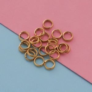 Golden double loop jump rings for DIY jewelry making on a colorful background