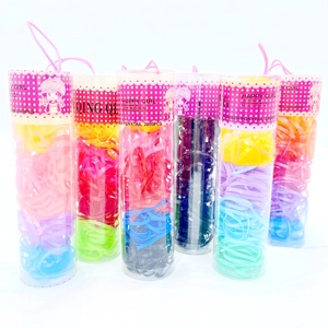 Detail view of 6 jars containing 2000 pieces of colorful rubber hair bands for women