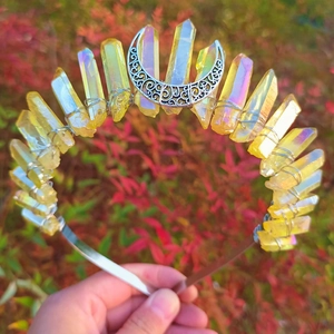 Detail of yellow crystal crown with AB coating and crescent moon on gold headband