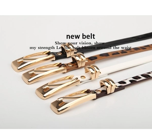 Detailed view of narrow women belts with gold alloy buckles in leopard and solid colors