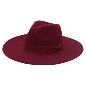 Detail of the elegant wine red wool felt hat featuring a matching ribbon bow decoration