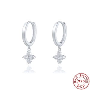 Detail of 925 sterling silver four-leaf clover drop earrings with sparkling zircon stones