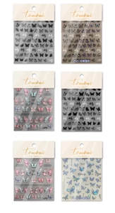Detailed macro view of 6 different styles of 3D embossed butterfly nail art stickers