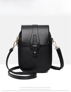 Front view of black pebble leather mini crossbody phone bag with gold hardware and teardrop strap