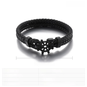 Macro shot of double-layer black leather bracelet with stainless steel rudder charm