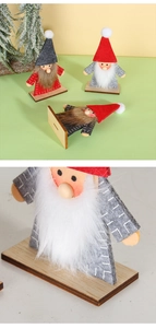 Detail of handcrafted wooden gnome figurines with felt hats and thick white beards