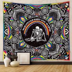 Detail of bohemian tapestry featuring skeletons and rainbow with whatever makes you happy text