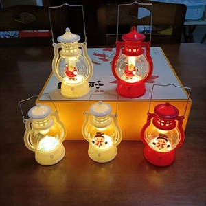 Luminous Christmas lanterns featuring Santa, snowman and tree patterns on a wooden table