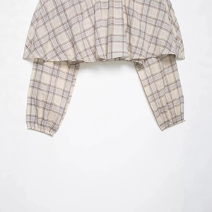 Plaid long sleeve crop top with elastic cuffs and woven beige brown checkered pattern
