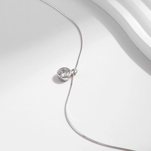 Minimalist S925 sterling silver snake chain necklace with a sparkling round solitaire pendant