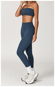 Detail of blue-grey brushed yoga set featuring high-waisted leggings and crop top