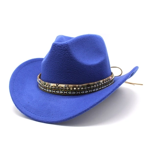Detail of royal blue cowboy hat featuring ethnic woven band and textured wool felt