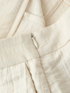 Macro view of seamless invisible zipper and textured fabric on beige embroidery set
