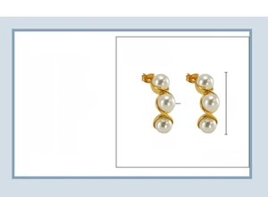 Detail of 18K gold plated stainless steel earrings featuring three white pearls