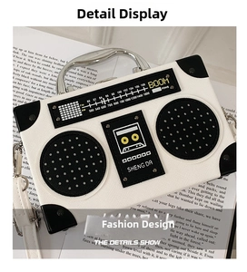 Macro detail of retro radio box bag with metallic rivets and white textured material