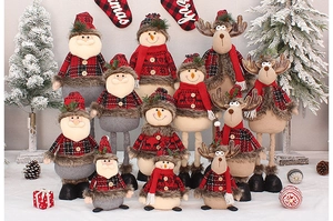 Detailed collection of festive Christmas plush dolls with red checkered patterns and wood buttons