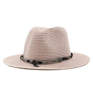 Elegant beige straw fedora sun hat with black ribbon and feather decoration for beach