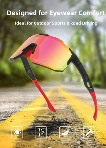 Detail of sports cycling sunglasses featuring red polarized lenses on a blurred road background