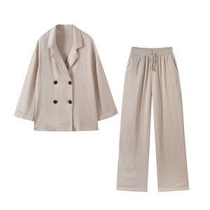Women's two-piece pleated blazer and pants set in apricot with vertical texture