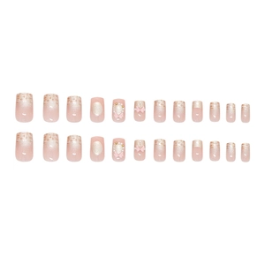 Pink gradient press-on nails set with pearls and 3D bow designs in a short square shape