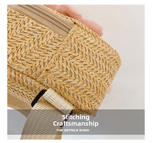 Macro detail of hand-woven straw texture with metal zipper and adjustable strap