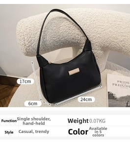 Detail view of black lychee texture shoulder bag with size 24cm x 17cm and gold hardware