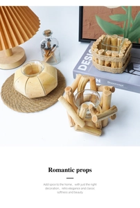 Detailed view of rustic driftwood candle holder with transparent glass insert on table