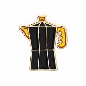 Detailed view of moka pot enamel pin with black and yellow finish on metal base
