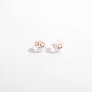 S925 sterling silver and silicone earring backs in rose gold finish on white background