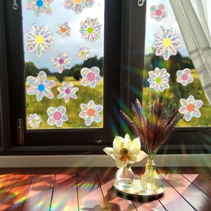 Rainbow suncatcher window sticker with floral prism design projecting colorful light spots