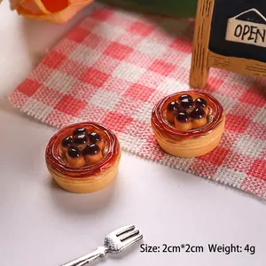 Close-up of a 2cm miniature tart model with berries for DIY dollhouse and crafts