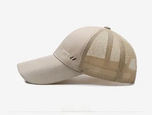 Detail view of beige sport baseball cap with breathable mesh and side logo text