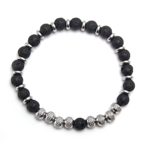 Lava stone and silver metal bead stretch bracelet featuring a small angel charm