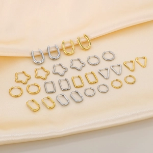 Assorted geometric stainless steel earrings in gold and silver finish on silk