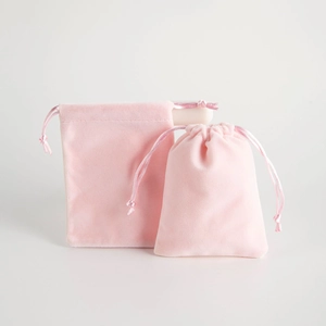 Pink velvet drawstring jewelry gift bags in two sizes for elegant accessory storage