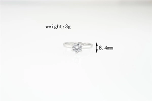 Moissanite ring detail showing 3g weight and 8.4mm stone size on white background