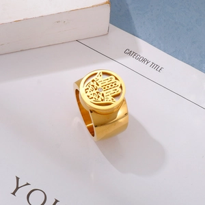 Detail shot of golden Hamsa Hand wide ring with white zircon in a bohemian style