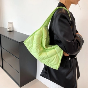 Quilted nylon shoulder bag in neon green featuring a spacious rhombic diamond pattern