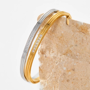 Polished stainless steel bangles with striped zircon inlay in gold and silver finish
