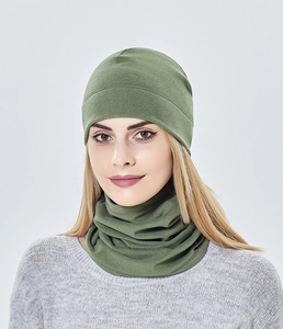 Detail of olive green knit beanie and neck warmer set with soft fleece lining texture