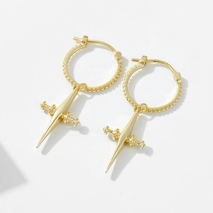 Detailed view of 925 sterling silver hoop earrings with gold plated cross sword charms