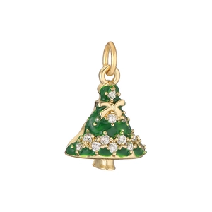 Close-up of golden Christmas tree pendant with green enamel and sparkling crystals