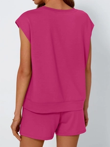 Back view of magenta sleeveless two-piece set featuring elastic waistband and casual cut