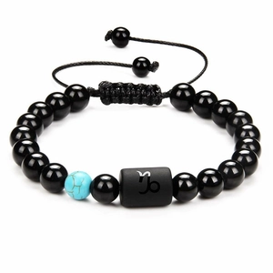 Detail of Capricorn obsidian beaded bracelet with turquoise stone and adjustable cord