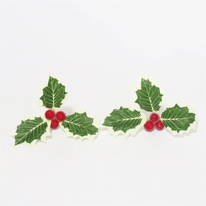 Detail of Christmas holly leaves with red berries for festive DIY holiday ornaments