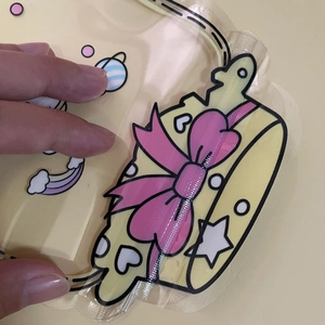 Cartoon cupcake ziplock bag with pink bow and floating charms for candy packaging