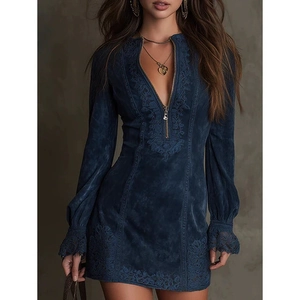 Detail of navy long sleeve dress featuring floral embroidery and metal zipper neckline