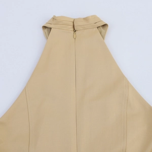 Detail shot of the back invisible zipper and stitching on the khaki high-neck dress